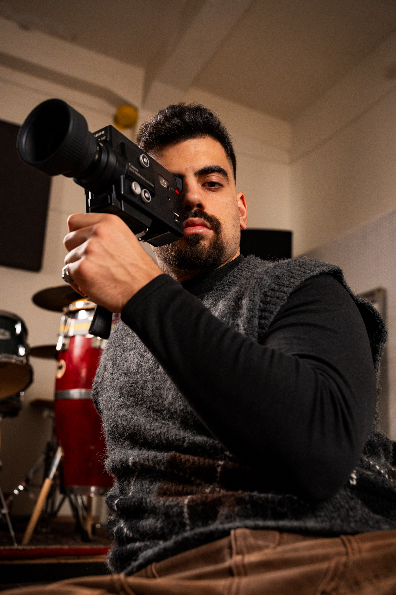 Portrait of Pablo del Rincón sitting in a studio space